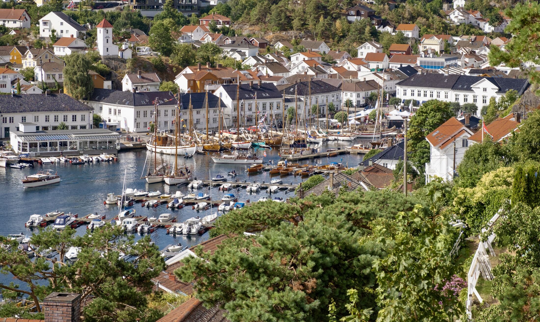 The harbour filled with wooden boats during the festival, seen from above