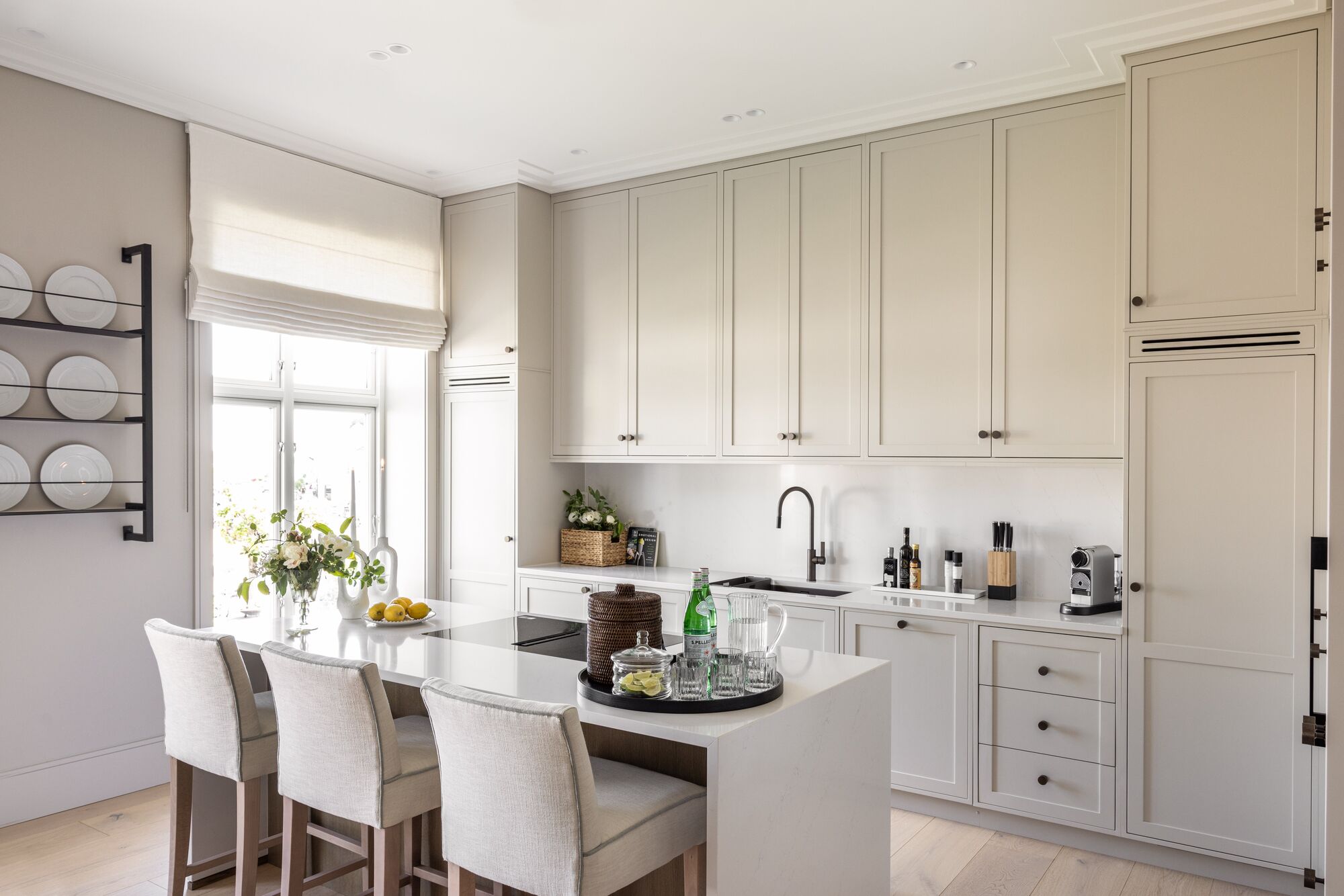 Kitchen with island and bar stools