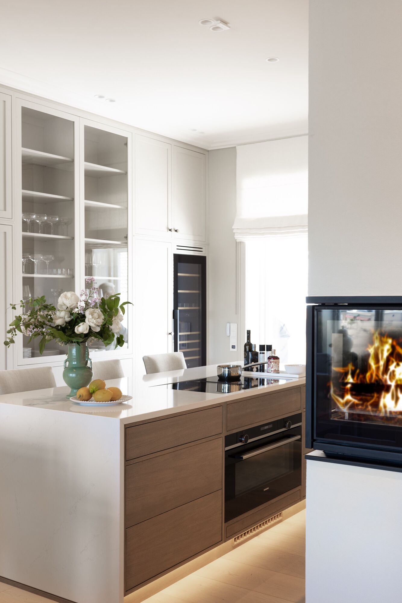Kitchen with fireplace and wine cabinet