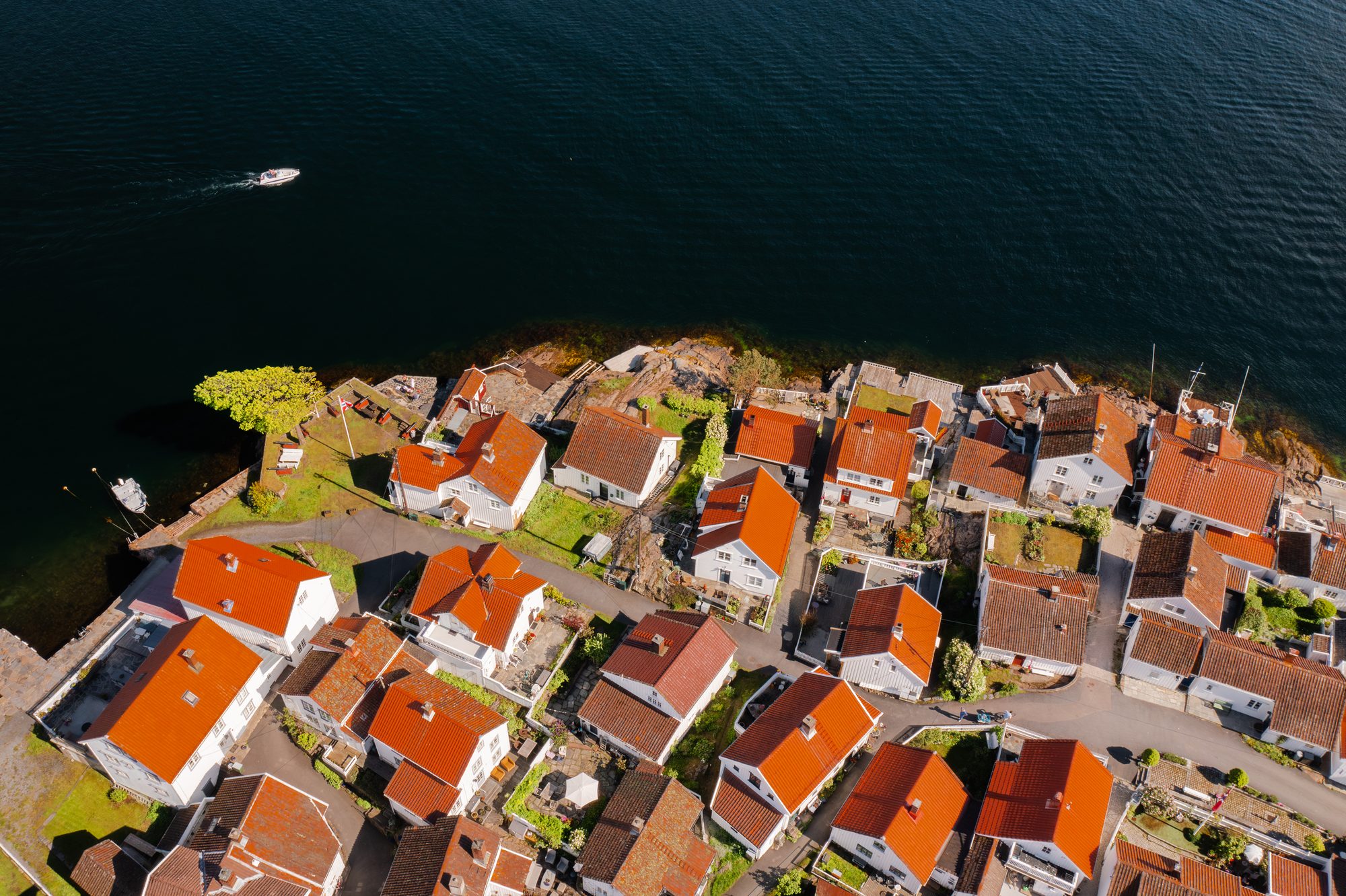 White houses with red roofs seen from above