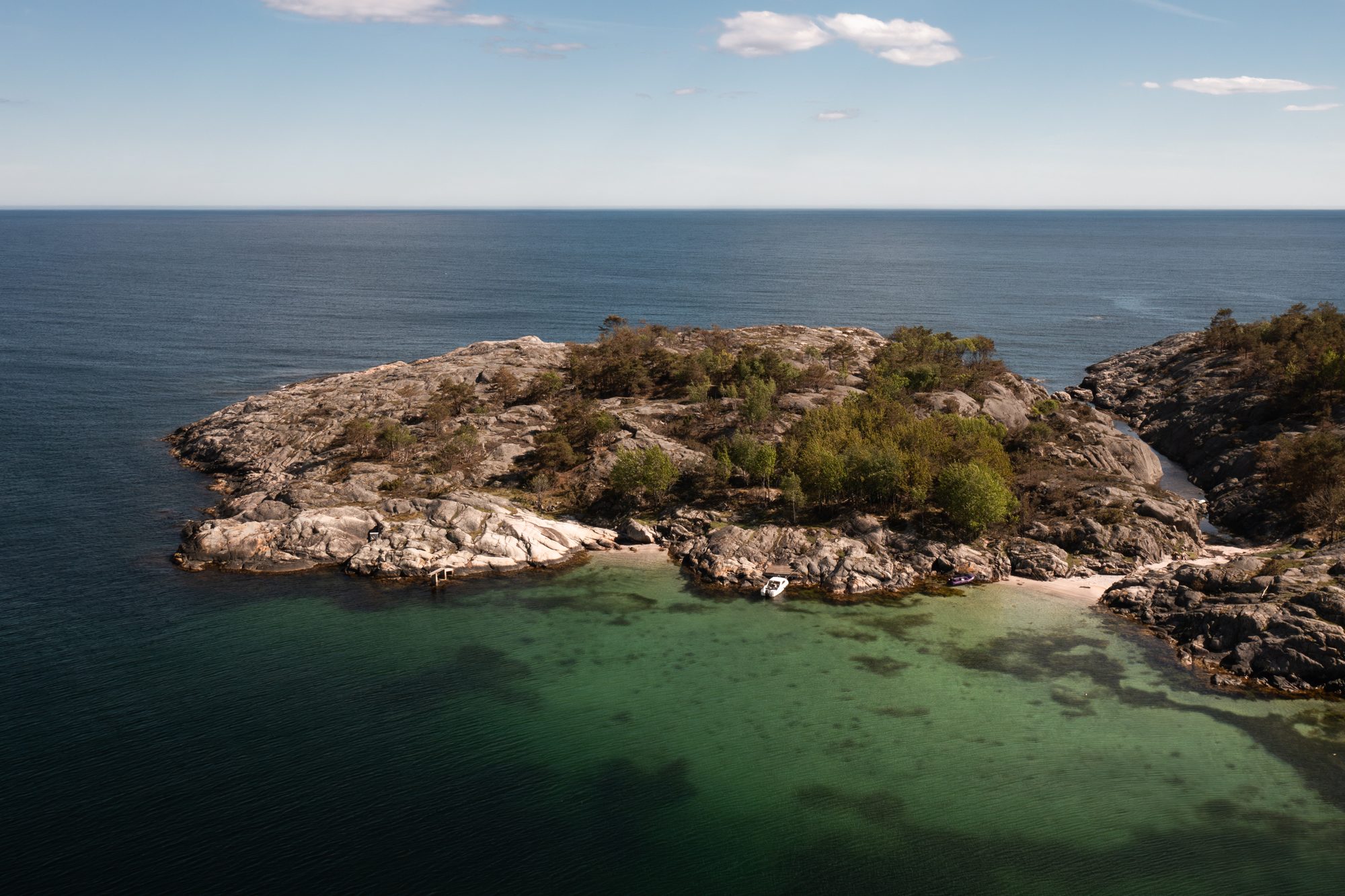 A bare skerry against the open sea